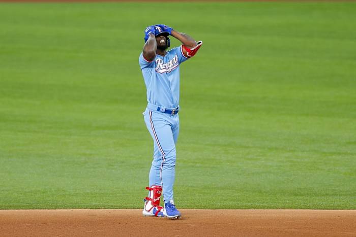 Jun 6, 2021; Arlington, Texas, USA; Texas Rangers pinch hitter Adolis Garcia (53) reacts after flying out at the warning track during the eighth inning against the Tampa Bay Rays at Globe Life Field.